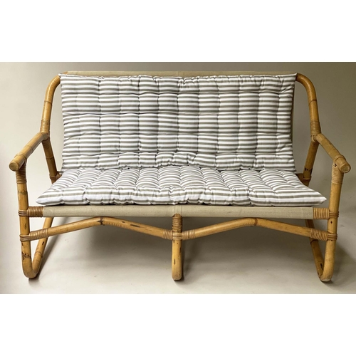 618 - BAMBOO SOFA, framed and cane bound with canvas and striped cushions, 124cm W.