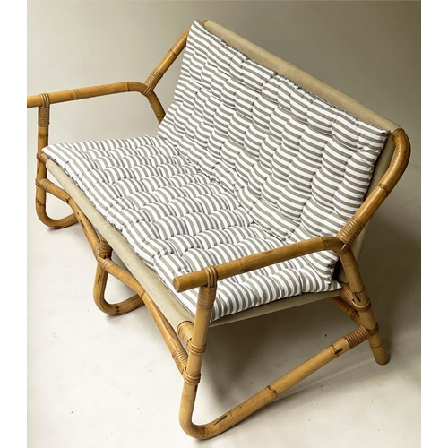 618 - BAMBOO SOFA, framed and cane bound with canvas and striped cushions, 124cm W.