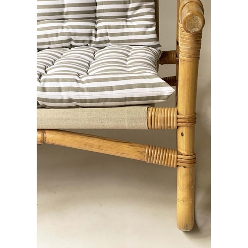 618 - BAMBOO SOFA, framed and cane bound with canvas and striped cushions, 124cm W.