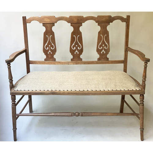 627 - HALL BENCH, early 20th century Edwardian, fruitwood, with pierced splat backs and studded linen seat... 