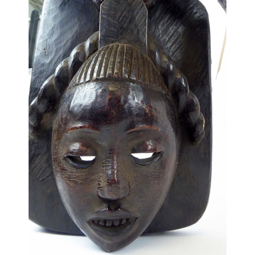 375 - EKPE EKOI MASKS, two, Cameroon, headdress mask, skin covered, 70cm H x 60cm. (2)