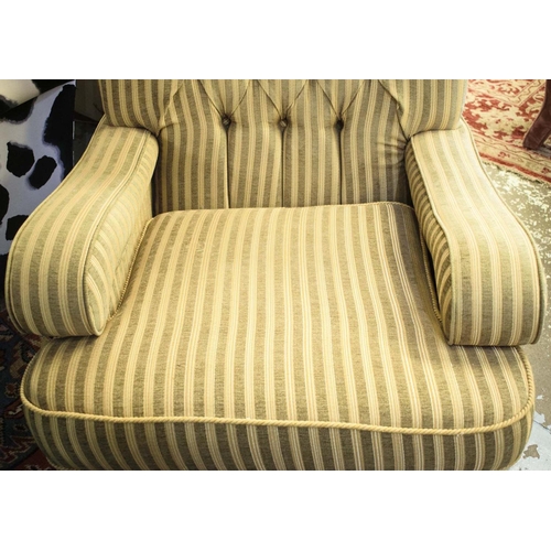 498 - ARMCHAIR, 93cm H x 80cm W x 105cm D, striped upholstery with cushion seat and brass front castors.