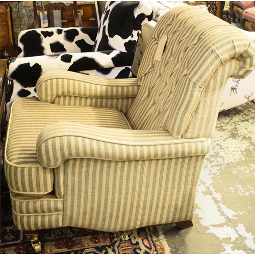 498 - ARMCHAIR, 93cm H x 80cm W x 105cm D, striped upholstery with cushion seat and brass front castors.