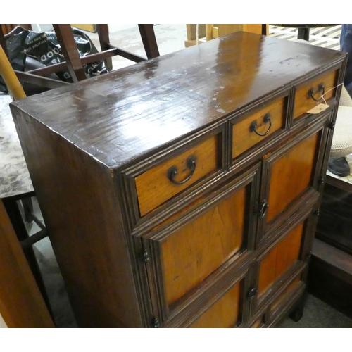 496 - KOREAN CABINET. 69cm W x 102cm x 34cm, 19th century elm, with three drawers and four doors.