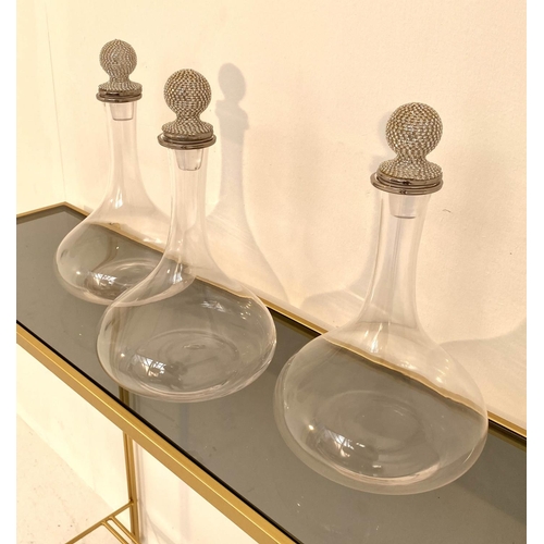 223 - DECANTERS, a set of three, 31cm H, diamante detail. (3)