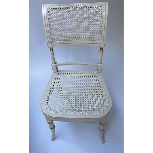 518 - DINING CHAIRS, a set of twelve, Regency style grey painted and parcel gilt with cane seats and ivory... 