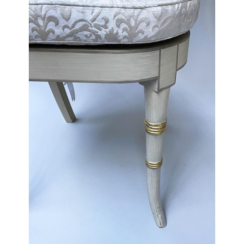 518 - DINING CHAIRS, a set of twelve, Regency style grey painted and parcel gilt with cane seats and ivory... 