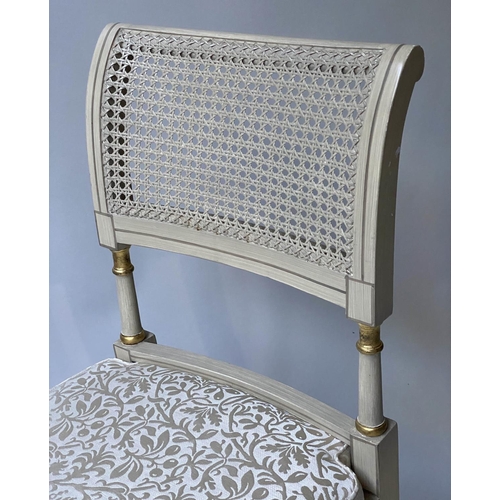 518 - DINING CHAIRS, a set of twelve, Regency style grey painted and parcel gilt with cane seats and ivory... 