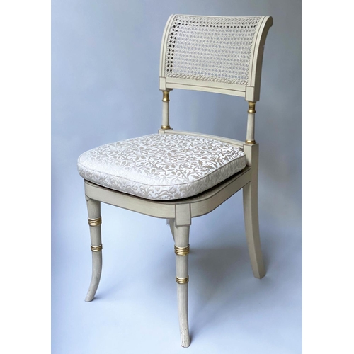 518 - DINING CHAIRS, a set of twelve, Regency style grey painted and parcel gilt with cane seats and ivory... 