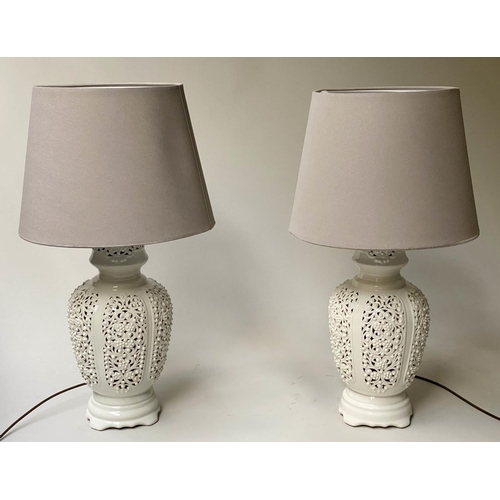 519 - TABLE LAMPS, a pair, reticulated white ceramic of vase form with shades, 76cm H. (2)