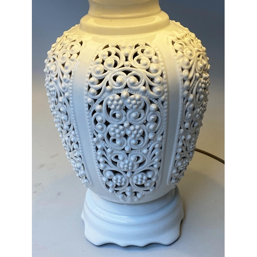 519 - TABLE LAMPS, a pair, reticulated white ceramic of vase form with shades, 76cm H. (2)