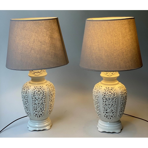 519 - TABLE LAMPS, a pair, reticulated white ceramic of vase form with shades, 76cm H. (2)