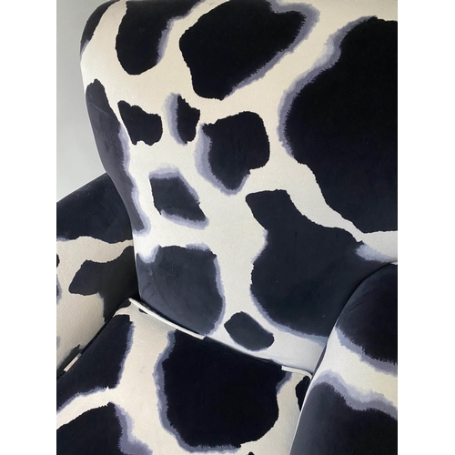 520 - ARMCHAIR, Howard style black and white printed velvet with scroll arms and bun front supports, 86cm ... 