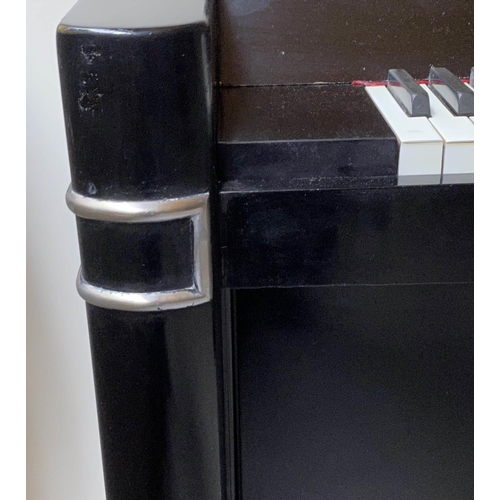 502 - EAVESTAFF MINI PIANO, Art Deco black lacquered and chrome mounted case, registration No. 12200, 130c... 