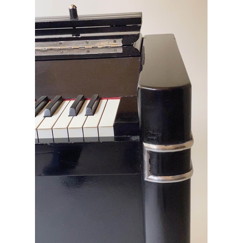 502 - EAVESTAFF MINI PIANO, Art Deco black lacquered and chrome mounted case, registration No. 12200, 130c... 