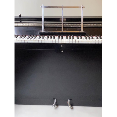 502 - EAVESTAFF MINI PIANO, Art Deco black lacquered and chrome mounted case, registration No. 12200, 130c... 