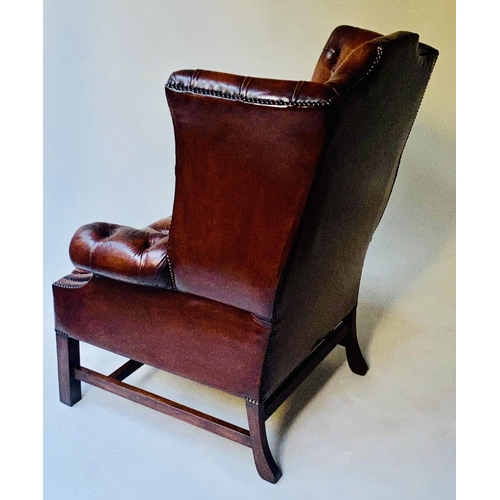 503 - WING ARMCHAIR, 84cm W, George III design buttoned brown leather, with scroll arms and stretchered su... 