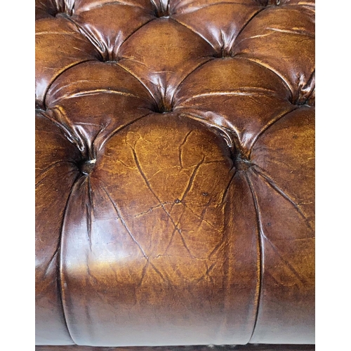 503 - WING ARMCHAIR, 84cm W, George III design buttoned brown leather, with scroll arms and stretchered su... 