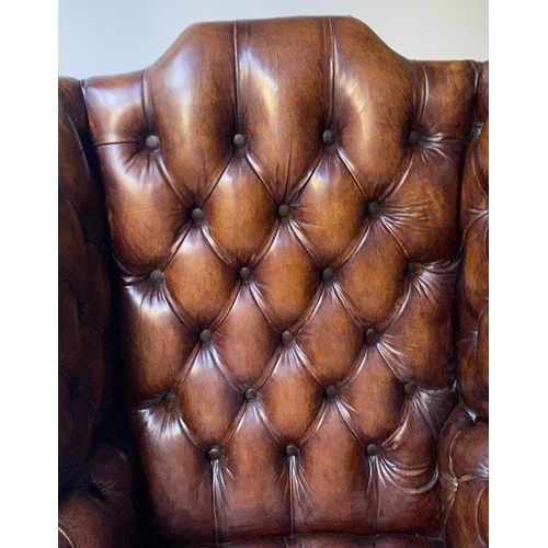 503 - WING ARMCHAIR, 84cm W, George III design buttoned brown leather, with scroll arms and stretchered su... 