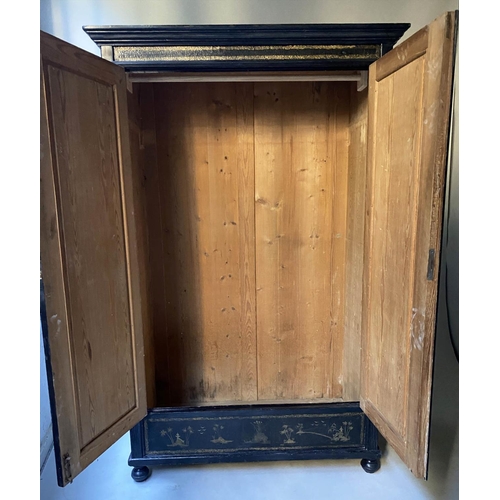 480 - CHINOISERIE WARDROBE, 19th century black lacquered and Chinoiserie panelled with two doors enclosing... 