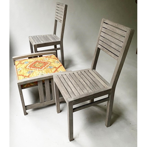 476 - GARDEN CHAIRS, a pair, weathered teak with a cushioned stool, 62cm x 53cm x 40cm H. (3)