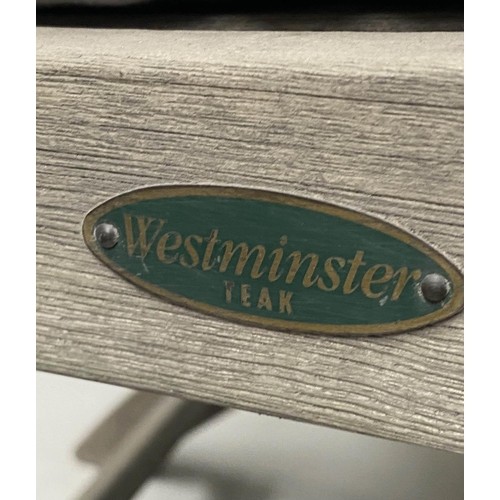 467 - GARDEN ARMCHAIRS, two weathered folding teak, one labeled Westminster, with a rectangular slatted ta... 