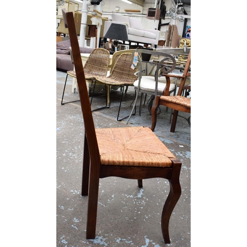 565 - FARMHOUSE DINING CHAIRS, 107cm H, a set of six, ash with rush seats, includes two carvers. (6)