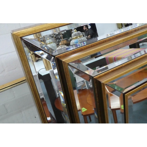 299 - WALL MIRROR, 117cm x 87cm, Art Deco style stepped frame, gilt accents.