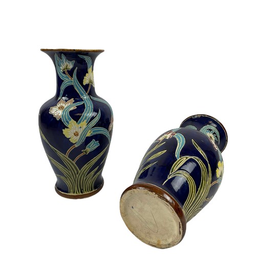 368 - VASES, a pair, Art Nouveau Majolica, with foliate decoration on dark blue glazed ground. 55cm H. (2)