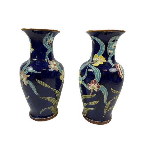 368 - VASES, a pair, Art Nouveau Majolica, with foliate decoration on dark blue glazed ground. 55cm H. (2)