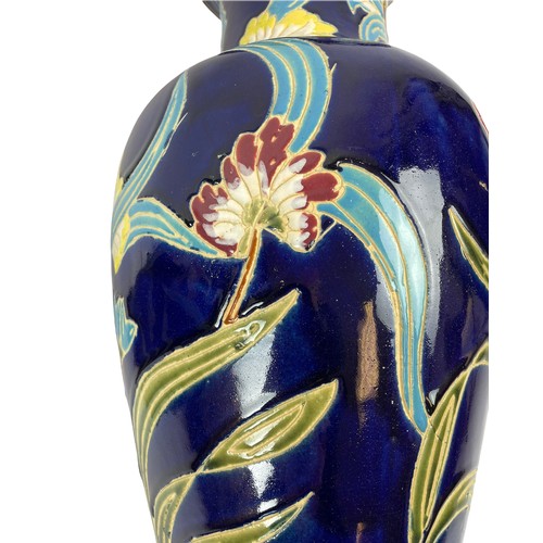 368 - VASES, a pair, Art Nouveau Majolica, with foliate decoration on dark blue glazed ground. 55cm H. (2)