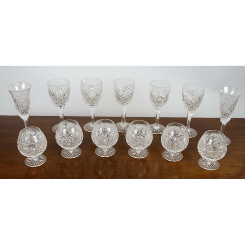 385 - WINE GLASSES, five, along with a set of six brandy glasses and two water glasses, all cut crystal gl... 