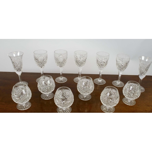 385 - WINE GLASSES, five, along with a set of six brandy glasses and two water glasses, all cut crystal gl... 