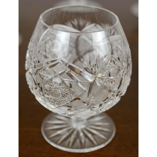 385 - WINE GLASSES, five, along with a set of six brandy glasses and two water glasses, all cut crystal gl... 