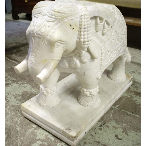 392 - ELEPHANT LOW TABLE, carved marble elephant base pillars, glass top, 150cm x 62cm x 50cm approx.