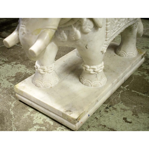 392 - ELEPHANT LOW TABLE, carved marble elephant base pillars, glass top, 150cm x 62cm x 50cm approx.