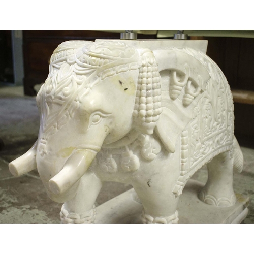 392 - ELEPHANT LOW TABLE, carved marble elephant base pillars, glass top, 150cm x 62cm x 50cm approx.