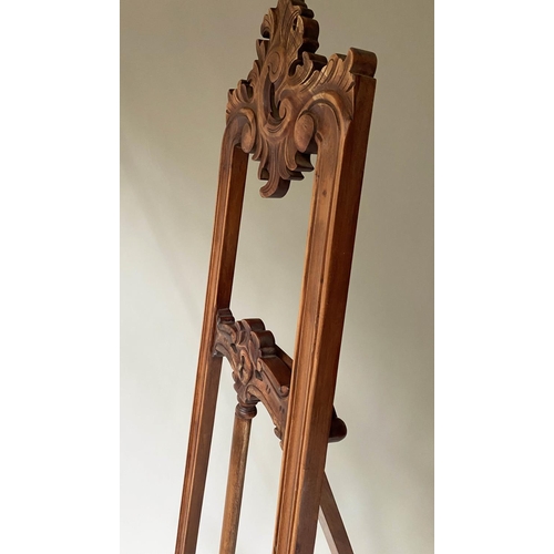 396 - EASEL, French style carved hardwood, with adjustable ledge. 203cm H x 70cm W