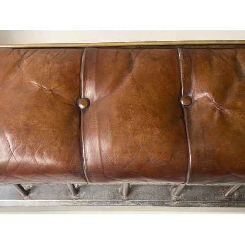 398 - CLUB FENDER, early 20th century, buttoned tan leather, raised upon metal balustrade support, 160cm W... 