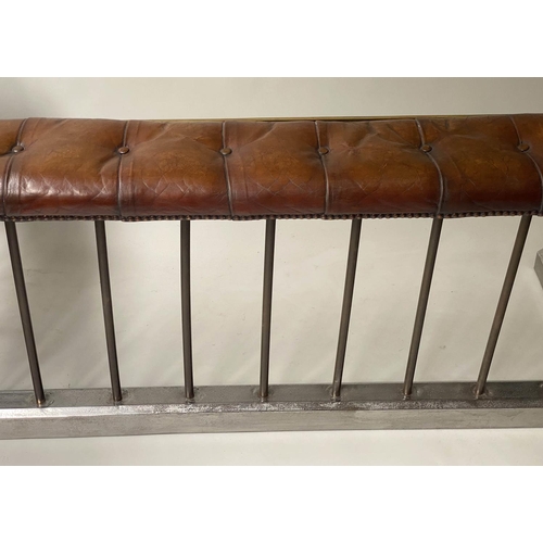 398 - CLUB FENDER, early 20th century, buttoned tan leather, raised upon metal balustrade support, 160cm W... 