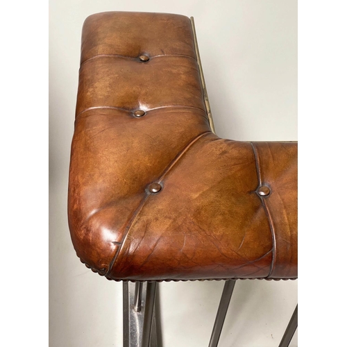 398 - CLUB FENDER, early 20th century, buttoned tan leather, raised upon metal balustrade support, 160cm W... 