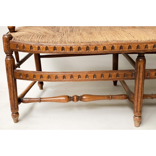 412 - HALL BENCH, late 19th century walnut, with twin arched spindle back and rush seat, probably American... 