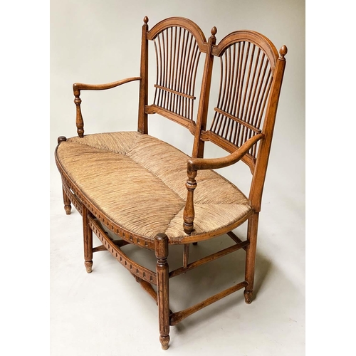 412 - HALL BENCH, late 19th century walnut, with twin arched spindle back and rush seat, probably American... 