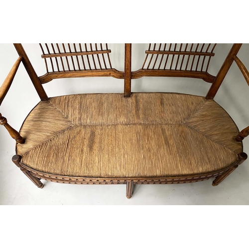 412 - HALL BENCH, late 19th century walnut, with twin arched spindle back and rush seat, probably American... 