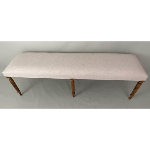 241 - HALL SEAT, neutral upholstered reeded supports, 151cm x 40cm x 49cm.