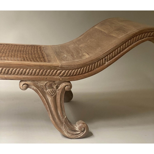 423 - WINDOW SEAT, Anglo Indian teak, with scroll ends, cane panelling and carved supports, 180cm x 55cm.