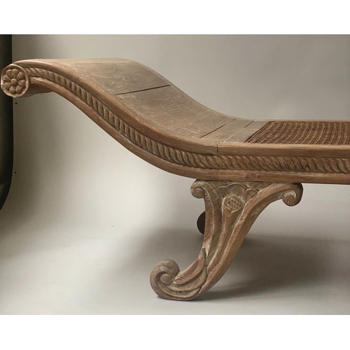 423 - WINDOW SEAT, Anglo Indian teak, with scroll ends, cane panelling and carved supports, 180cm x 55cm.