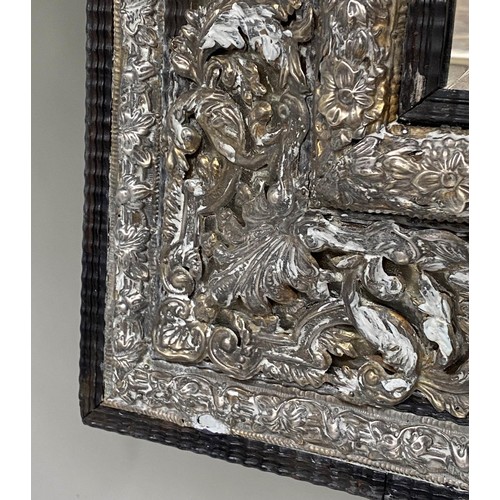 524 - WALL MIRROR, 111cm H x 95cm W, 19th century Dutch, cushion form, repoussé silvered metal, with bevel... 