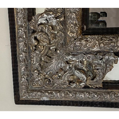 524 - WALL MIRROR, 111cm H x 95cm W, 19th century Dutch, cushion form, repoussé silvered metal, with bevel... 