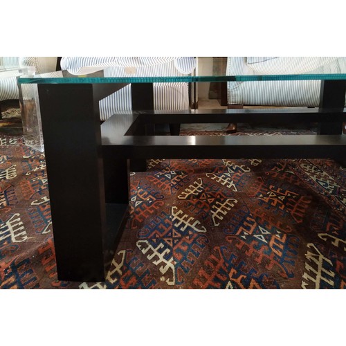 557 - LOW TABLE, 42cm H x 105cm W, ebonised with square glass top.